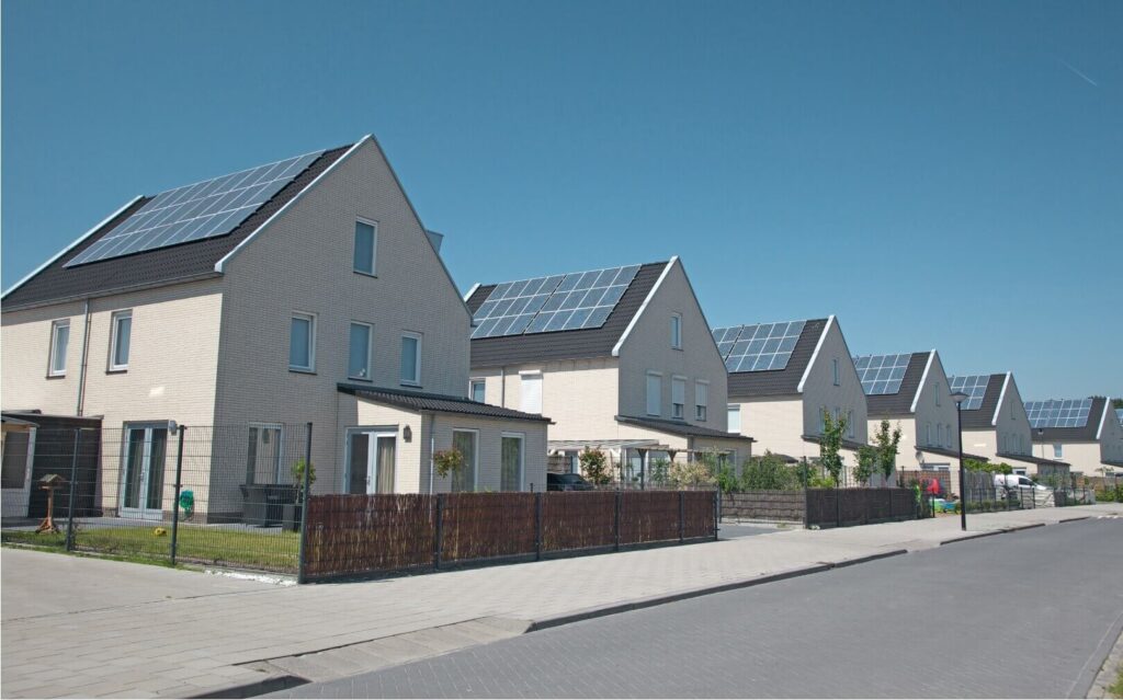 houses with solar panels on the roofs