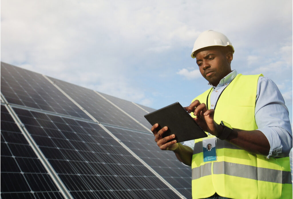 Asset manager checks solar panel on-site