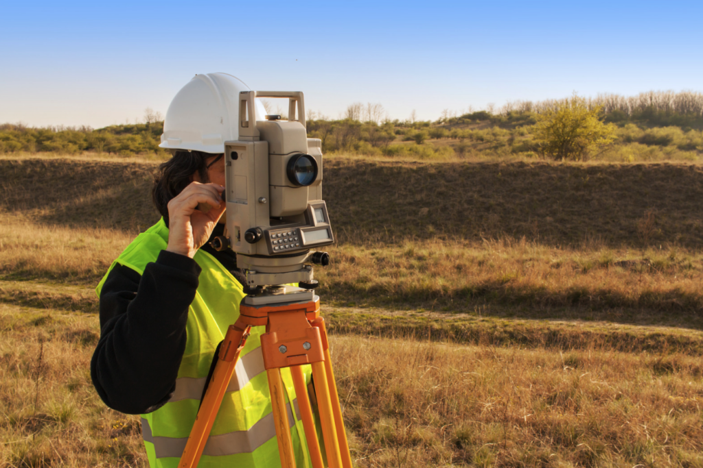 A field worker surveys a landscape