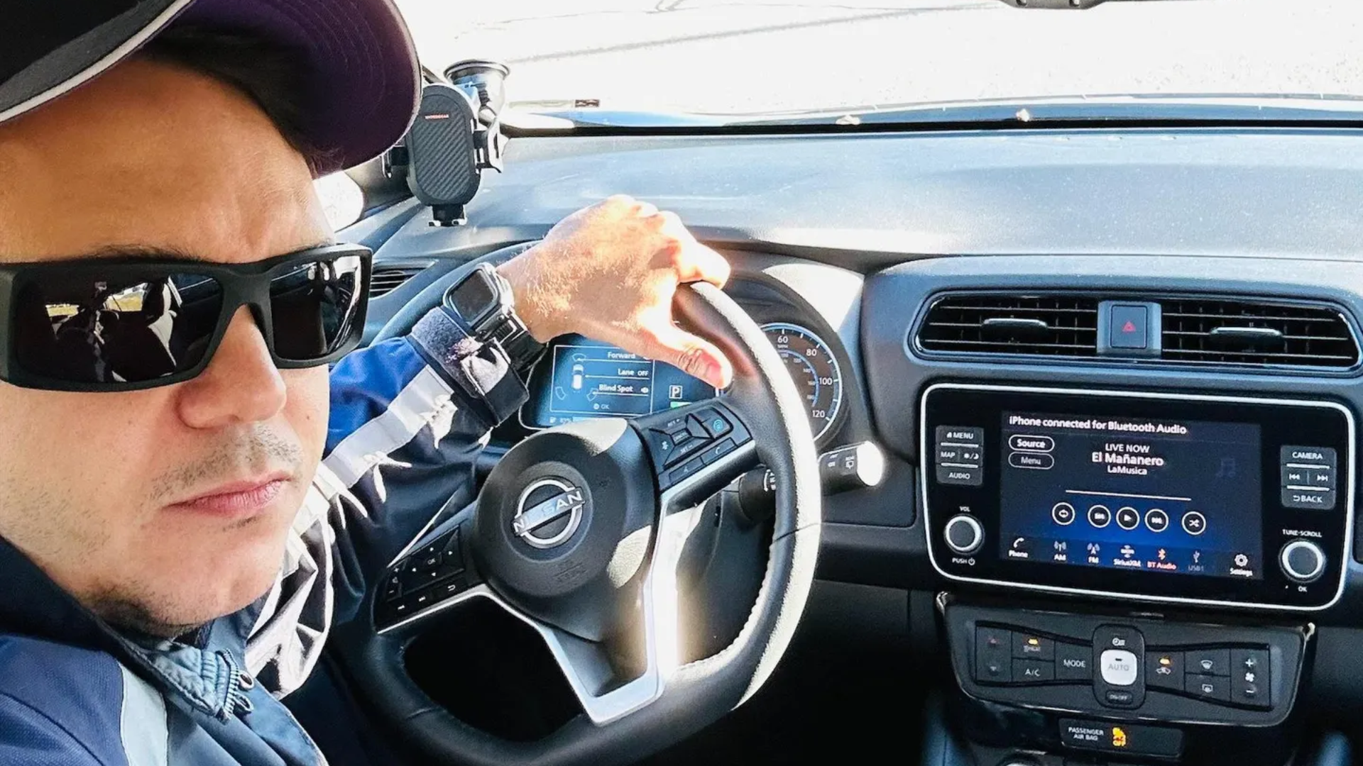 Kelvyn Lopez in his Nissan Leaf