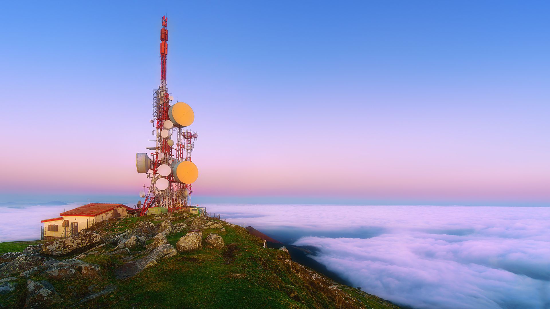 telecommunications tower on a mountain top at sunrise