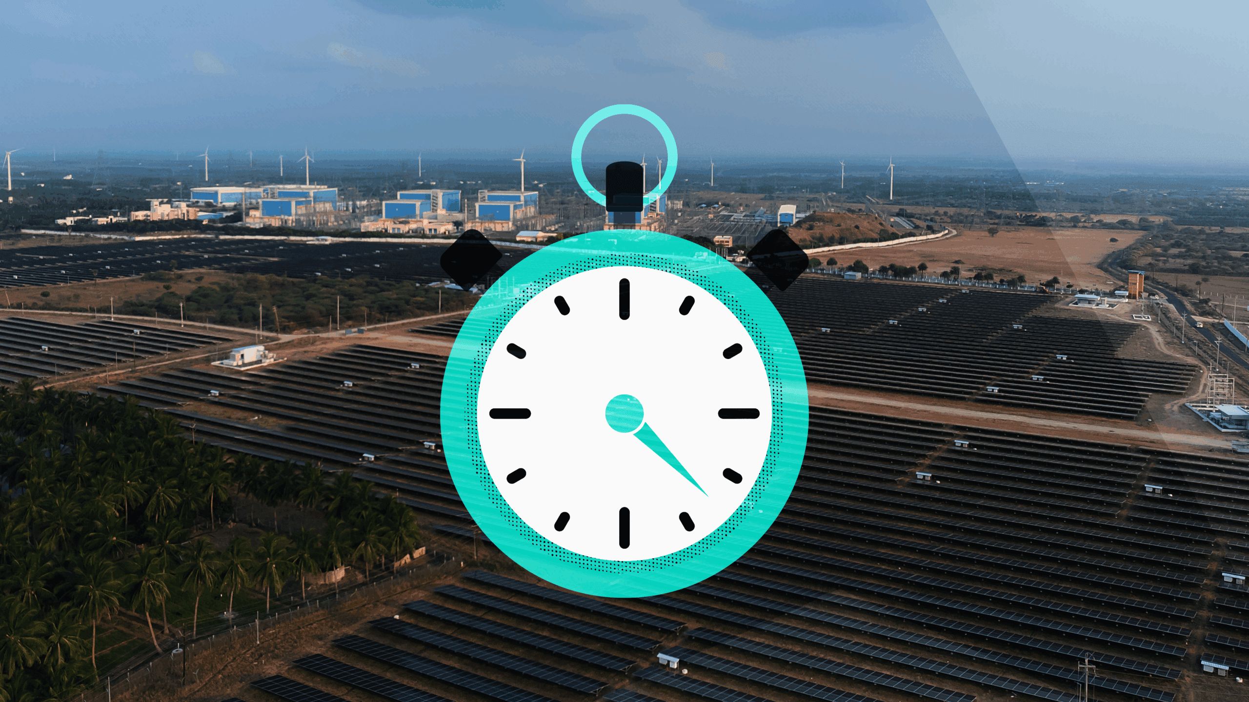 a stopwatch icon over a photo of a field of solar panels and wind turbines