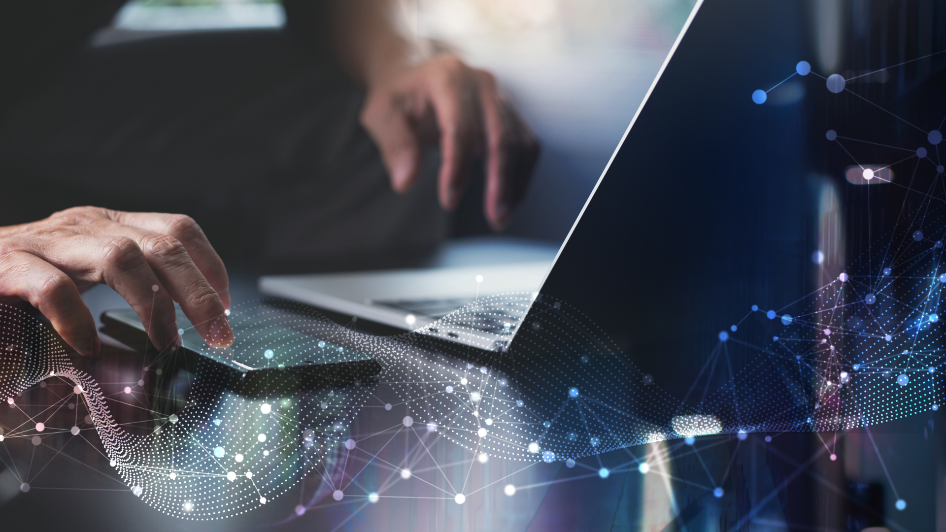 Close-up of hands using a laptop, overlaid with abstract digital network lines and data points, representing technology, data connectivity, and digital transformation.