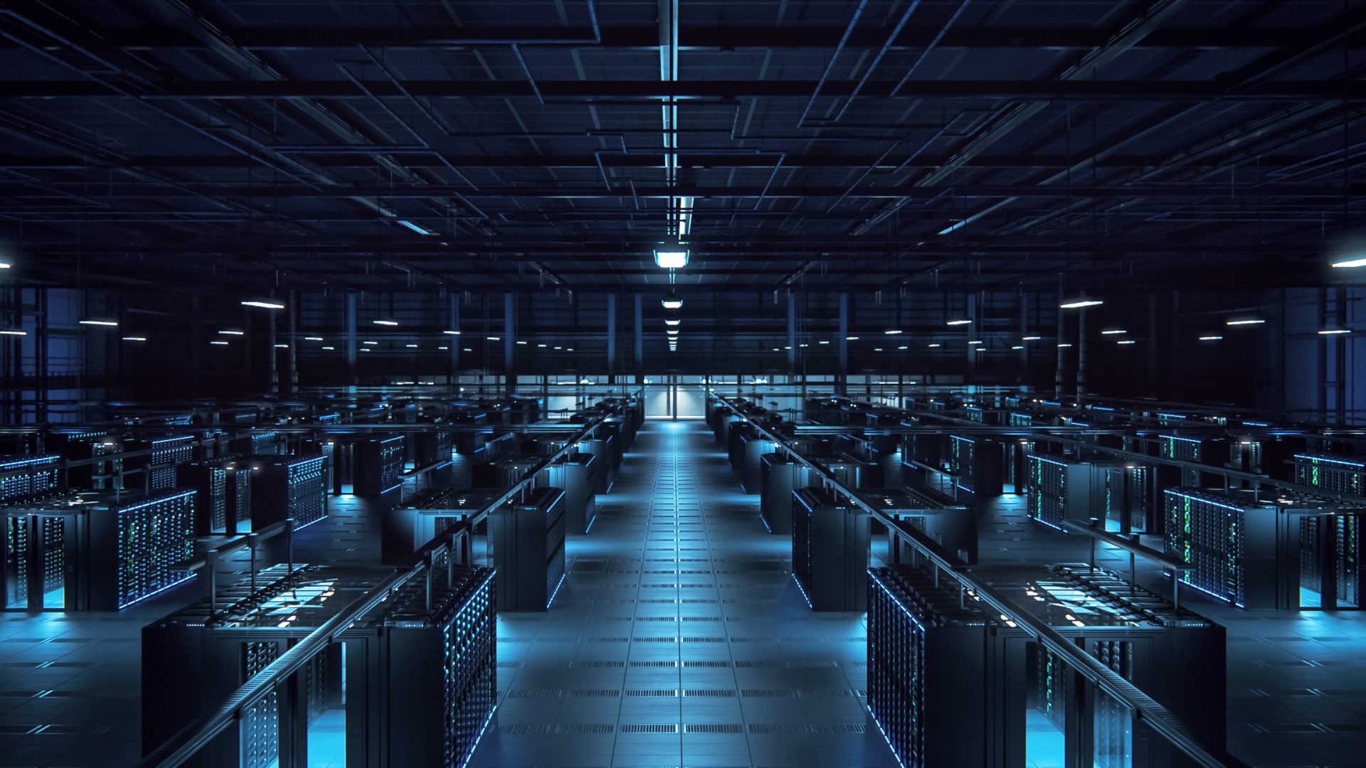 Rows of illuminated server racks inside a large data center supporting AI infrastructure.